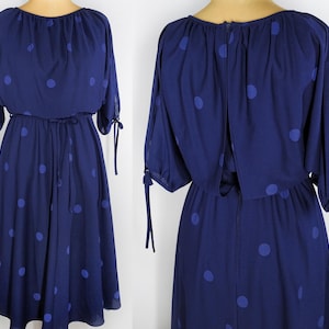 Vintage polka dot midi dress with batwing sleeves in navy blue from the 80s