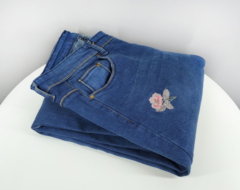 Vintage blue jeans with floral embroidery