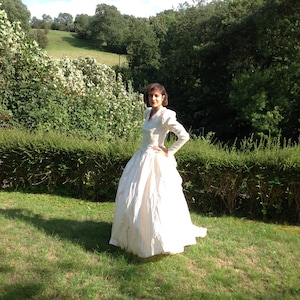 Never worn cream pure silk wdupion wedding dress.