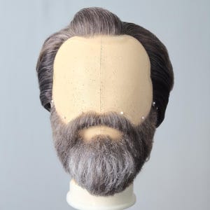 A set of wig, fake beard and moustache of a famous wizard in his younger years