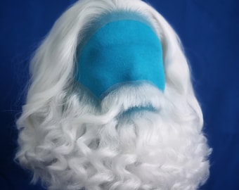 May include: A white wig with long, curly hair and a matching beard. The wig is on a mannequin head with a blue fabric covering the face.