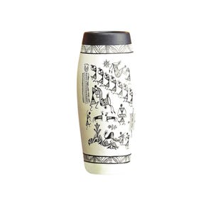 May include: A white ceramic vase with a black rim and base, adorned with black tribal art. The vase features a cylindrical shape with a slightly wider middle section. The artwork depicts stick figures and animals.