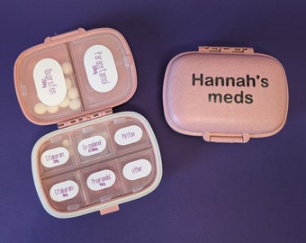Pill organiser box with custom labels