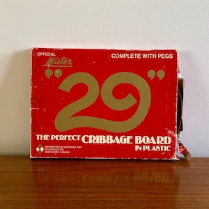 May include: Red and gold cribbage board game box with the text "Official Mister 29" and "The Perfect Cribbage Board in Plastic".