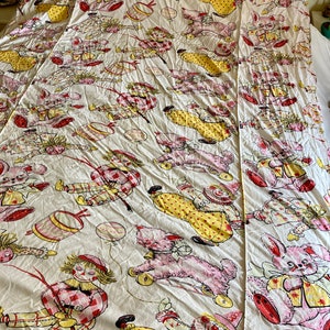 May include: A white cotton twin-sized bed sheet with a vintage pattern of clowns, teddy bears, and bunnies. The pattern is in shades of pink, yellow, red, and blue.
