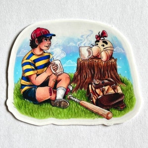 May include: A cartoon illustration of a character from the video game Earthbound sitting on the ground next to a tree stump with a pink character with a red bow. The character is holding a mug of coffee and there is a baseball bat on the ground.