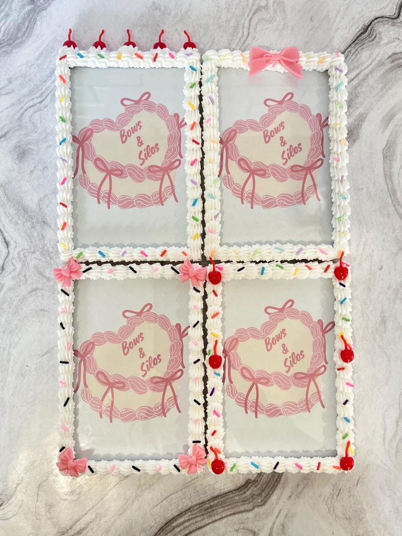 May include: Four white picture frames with a pink and white frosting design. Each frame has a pink heart with the text "Bows & Silos" inside. The frames are decorated with colorful sprinkles and red cherries.