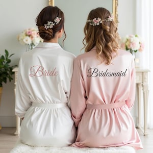 White and blush pink robes with custom text for women, bridesmaid, bride, friends and more. Great to wear on girls trips, spa days, bachelorette etc.