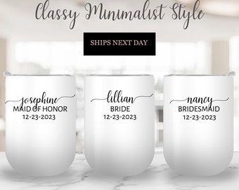May include: Three white stainless steel tumblers with black calligraphy. The tumblers are labeled "Josephine Maid of Honor 12-23-2023", "Lillian Bride 12-23-2023", and "Nancy Bridesmaid 12-23-2023".