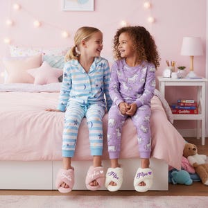 Girls fuzzy slippers for sleepover and birthday party favors. These girls slippers are available in sizes 3T to 3Y for ages 3 years to 10 years.