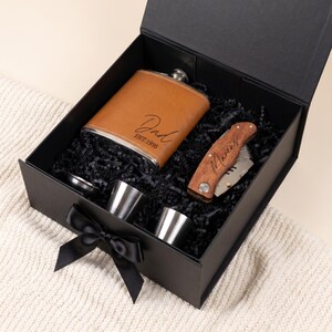 Sleek gift box for dad with personalized pocket knife and personalized flask. A great personalized dad gift for fathers day or birthday.