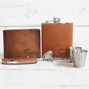 Brown theme personalized dad gift box. This gift box for dad comes with a personalized mens wallet, a custom leather flask, and a personalized wooden pocket knife.