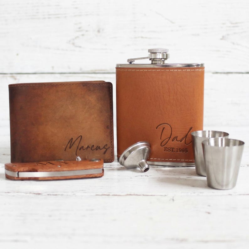 Brown theme personalized dad gift box. This gift box for dad comes with a personalized mens wallet, a custom leather flask, and a personalized wooden pocket knife.