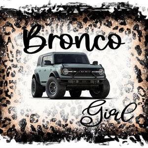 May include: A white Ford Bronco with black accents and the text "Bronco Girl" on a brown and black leopard print background.