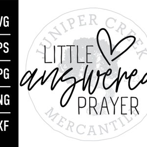 May include: Black and white graphic design with a heart and the text "Little Answered Prayer" in a circle with the text "Juniper Creek Mercantile" around the outside.