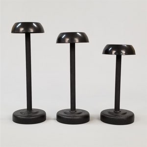 Black Helmet Stand.  Fits most helmets.  (Star Wars, HALO, G.I. JOE, Football, Motorcycle, Power Rangers, Iron Man, Medieval, etc.)