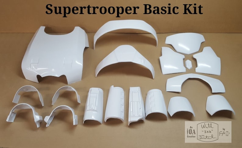 May include: A white plastic kit for building a Supertrooper costume. The kit includes pieces for the chest, back, arms, legs, and head. The pieces are all unpainted and ready to be assembled.