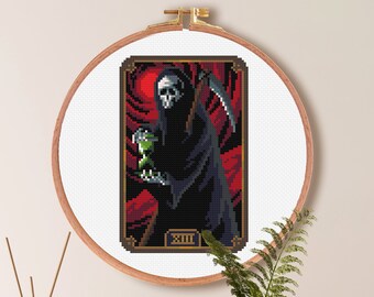 May include: Cross stitch pattern of Death holding a vial with a red background. The pattern is 60 stitches wide by 90 stitches high, and measures 4.3 inches by 6.4 inches. The pattern uses 23 DMC colors.