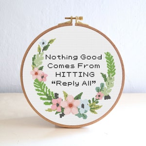 May include: A white embroidery hoop with a floral wreath design and the text "Nothing Good Comes From Hitting "Reply All"".