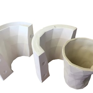 May include: A white silicone mold for making a geometric planter. The mold is in three pieces, and the finished planter is shown in the image.