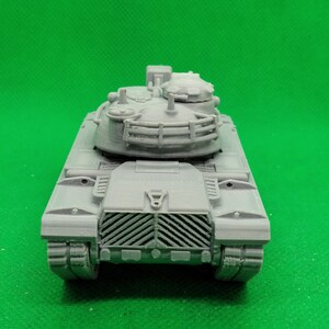 May include: A gray plastic model of a tank with a detailed turret and a grill-like front.