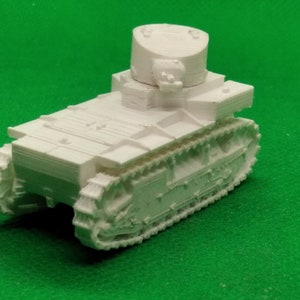 May include: White plastic model of a tank with a turret and tracks. The tank is on a green surface.