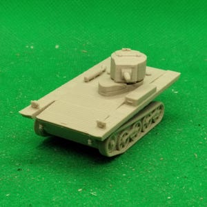 Puede incluir: Un modelo de plástico beige de un tanque anfibio de la Segunda Guerra Mundial. El tanque tiene una torreta elevada con un pequeño cañón y un casco plano y rectangular.