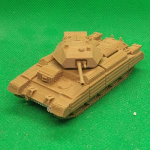 May include: A tan-colored model tank with a detailed design, including a turret, gun barrel, and tracks. The miniature military vehicle is set against a green background, showcasing its intricate features and overall structure.