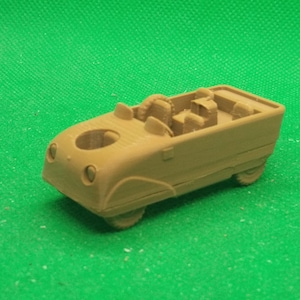 May include: A brown toy car with a removable top and seats. The car has a rounded front end and a flat back. The car is made of plastic and has a smooth finish.