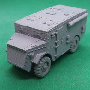 May include: A gray, detailed model of an armored car with a canvas top. The model has a textured surface and is made of plastic.