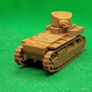 May include: A brown plastic model of a tank with a turret and tracks. The tank is on a green surface.