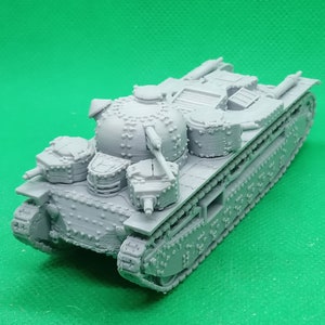 May include: A grey plastic model of a French Char B1 bis tank. The tank has a distinctive turret with multiple hatches and a large gun barrel.