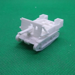 May include: White plastic model of a tank with a raised gun turret. The tank has a detailed track system and a small, open crew compartment.