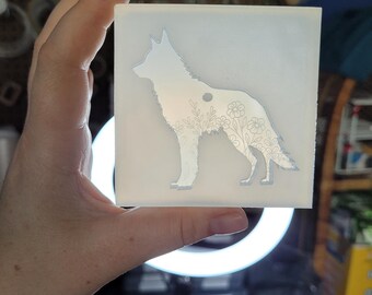 May include: A clear silicone mold with a detailed outline of a wolf with floral accents. The mold is designed for crafting and creating resin art.