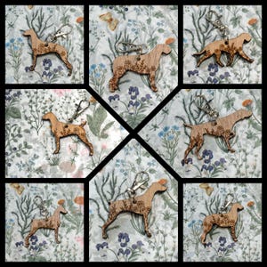 May include: A collection of wooden dog-shaped keychains with floral designs. Each keychain is attached to a silver-colored clasp. The keychains are displayed on a floral patterned background with butterflies.