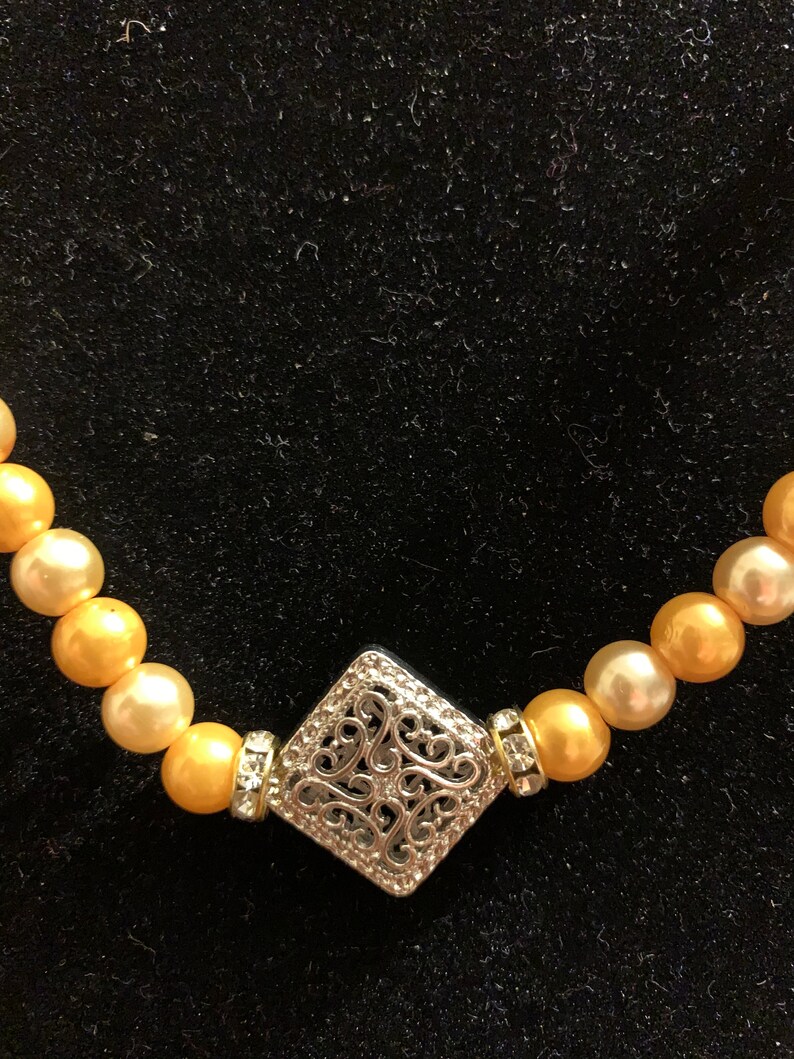 Two tone orange pearls