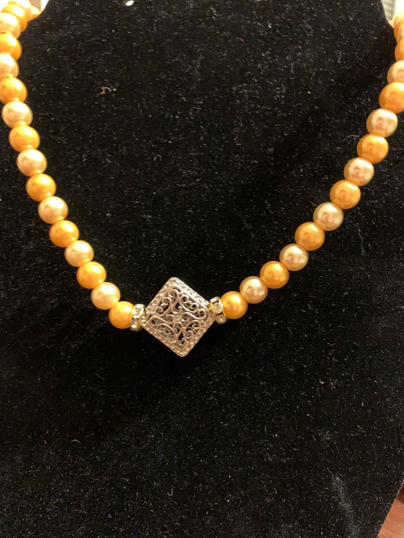Two tone orange pearls