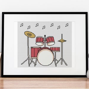 May include: A framed illustration of a red drum set with cymbals and music notes on a gray background.