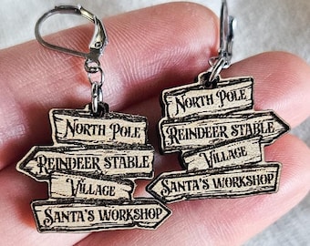 North Pole Sign Earrings – Laser-Cut Cherry Wood Holiday Jewelry, Unique Xmas Dangle Earrings, Santa’s Workshop Gift