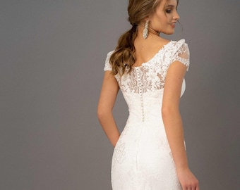 Abito da sposa a sirena in pizzo: un'eleganza senza tempo per il tuo grande giorno.