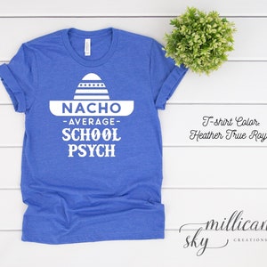 May include: A blue t-shirt with a white graphic of a sombrero and the text "NACHO -AVERAGE- SCHOOL PSYCH".