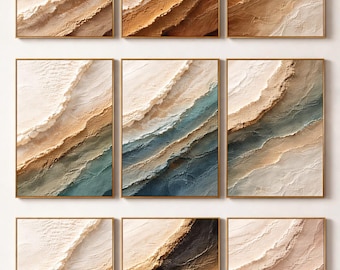 May include: Nine framed abstract art pieces. Each artwork presents a textured, layered design with colours ranging from beige and brown to blue and black, suggesting a landscape or coastal theme. The frames are a warm gold colour.