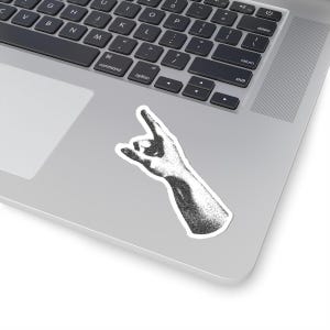 May include: Black and white illustration of a hand making the rock and roll hand gesture.