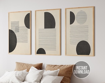 May include: Set of three abstract art prints with black and white geometric shapes on a beige background. The prints are framed in natural wood.
