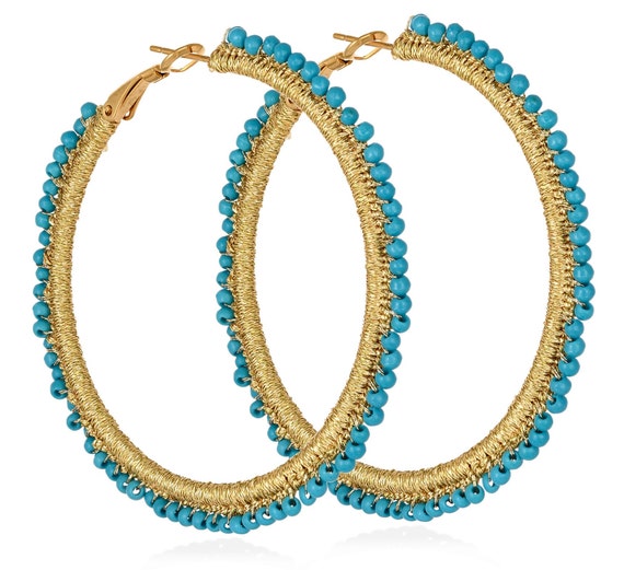 Aenaos Hoops (aenh502) Steel hoops, turquoise howlite beads and gold thread.