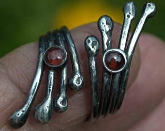 Garnet and silver open ring