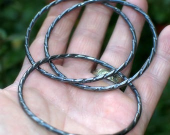 Sterling silver set of three slim interconnected twisted bangles, stackable bracelets