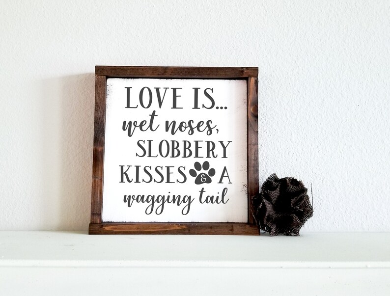 Love is wet noses slobbery kisses and a wagging tail  wood White