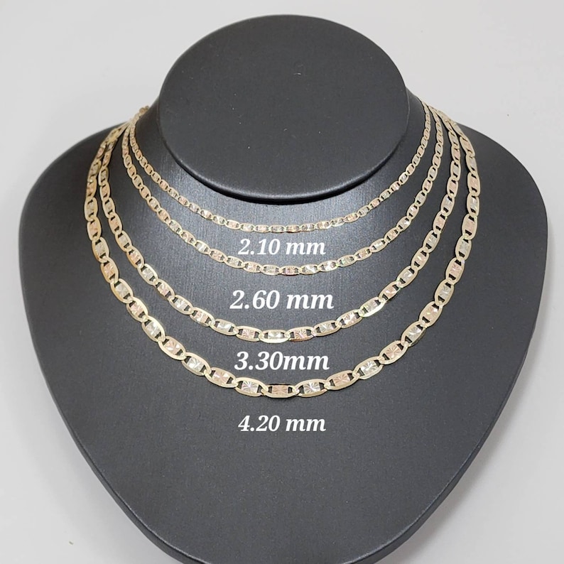 May include: Four gold mariner chains of different widths, displayed on a black mannequin. The chains are 2.10 mm, 2.60 mm, 3.30 mm, and 4.20 mm wide.