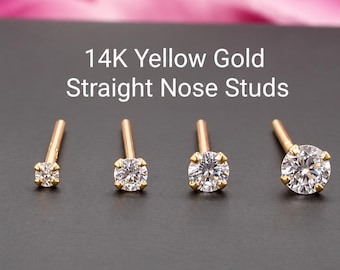 May include: Four 14K yellow gold straight nose studs with clear round-cut stones in prong settings, arranged in a row from smallest to largest. The text 14K Yellow Gold Straight Nose Studs is centered above the jewelry pieces.